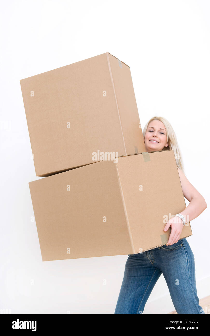 young female carrying cardboard boxes Stock Photo - Alamy