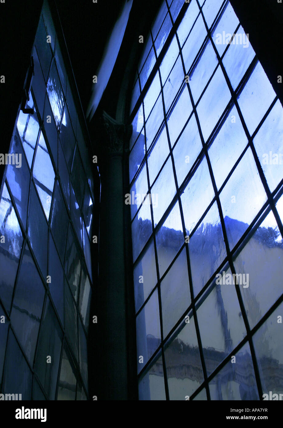 Convent mirroring in bluish tone in modern building glass window, Florence | Abtei spiegelt sich in blauer Glasscheibe Florenz Stock Photo