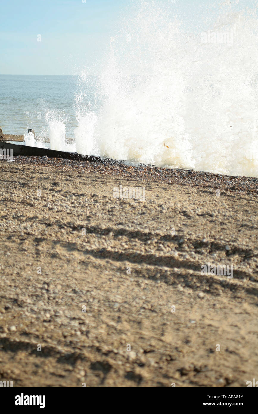 High waves hitting wooden sea defences in winter at Climping Beach, West Sussex, England, UK Stock Photo