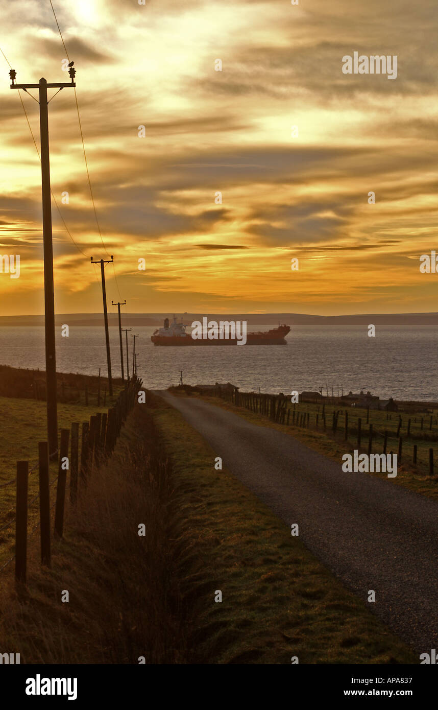 dh Shipping SCAPA FLOW ORKNEY Oil tanker ship at anchor dawn sunrise road vessel anchored silhouette early morning scotland ships Stock Photo