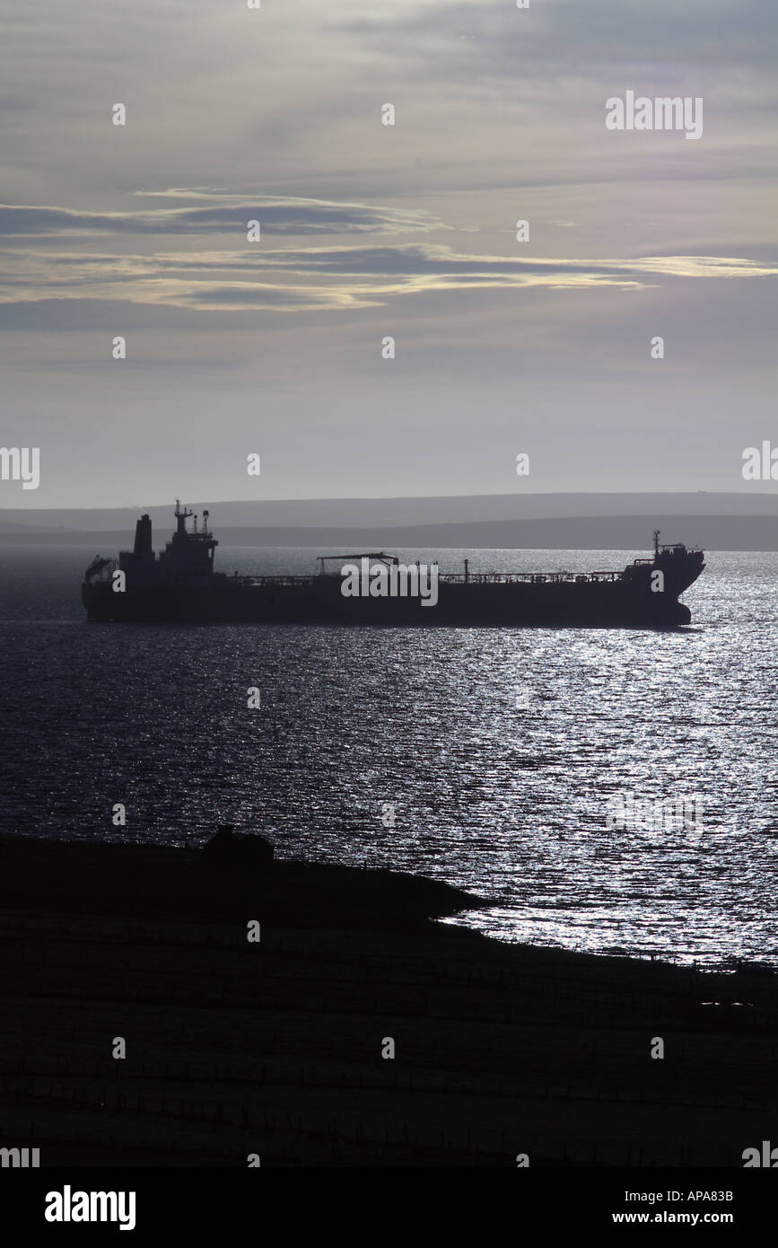 dh Shipping SCAPA FLOW ORKNEY Oil super tanker ship at anchor dawn sunlit silhouette Stock Photo