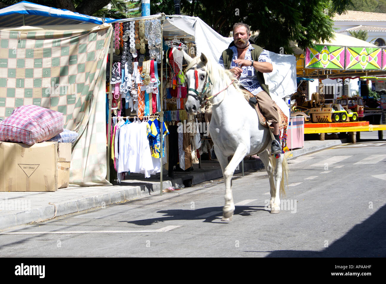 Man riding a white horse at the Mijas Feria, Spain Stock Photo