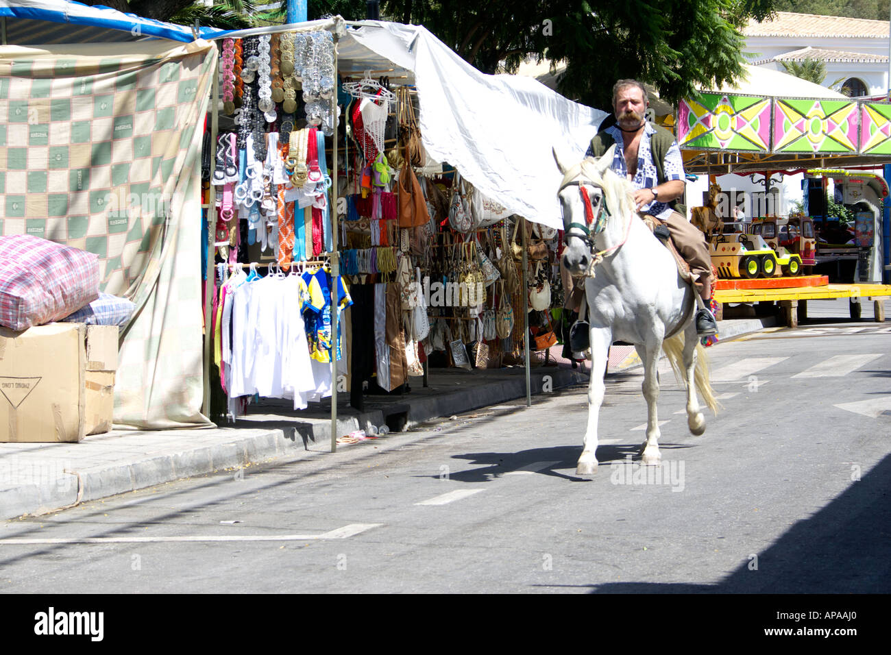 Man riding a white horse at the Mijas Feria, Spain Stock Photo