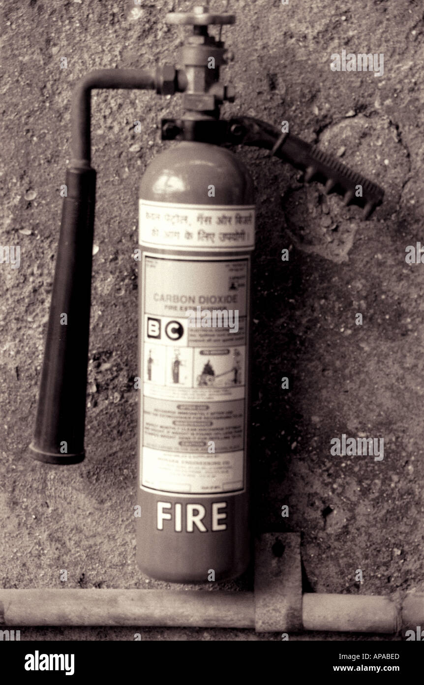 Fire extinguisher hanging on wall for safety Stock Photo - Alamy