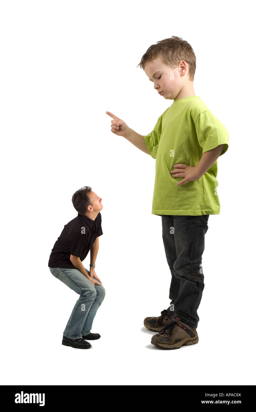 Caricature of a large son pointing his finger at the extra small dad Not always do the parents tell what must be done Stock Photo