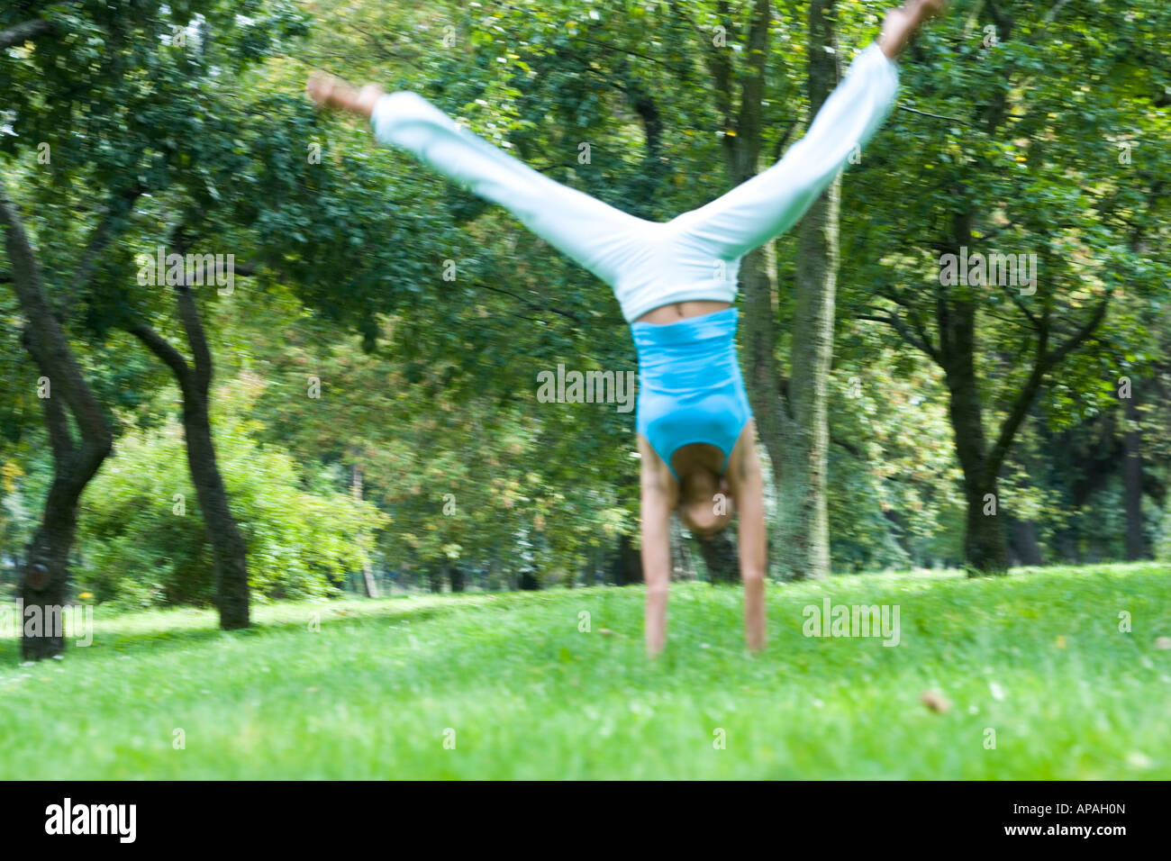 woman doing cartwheel Stock Photo Alamy