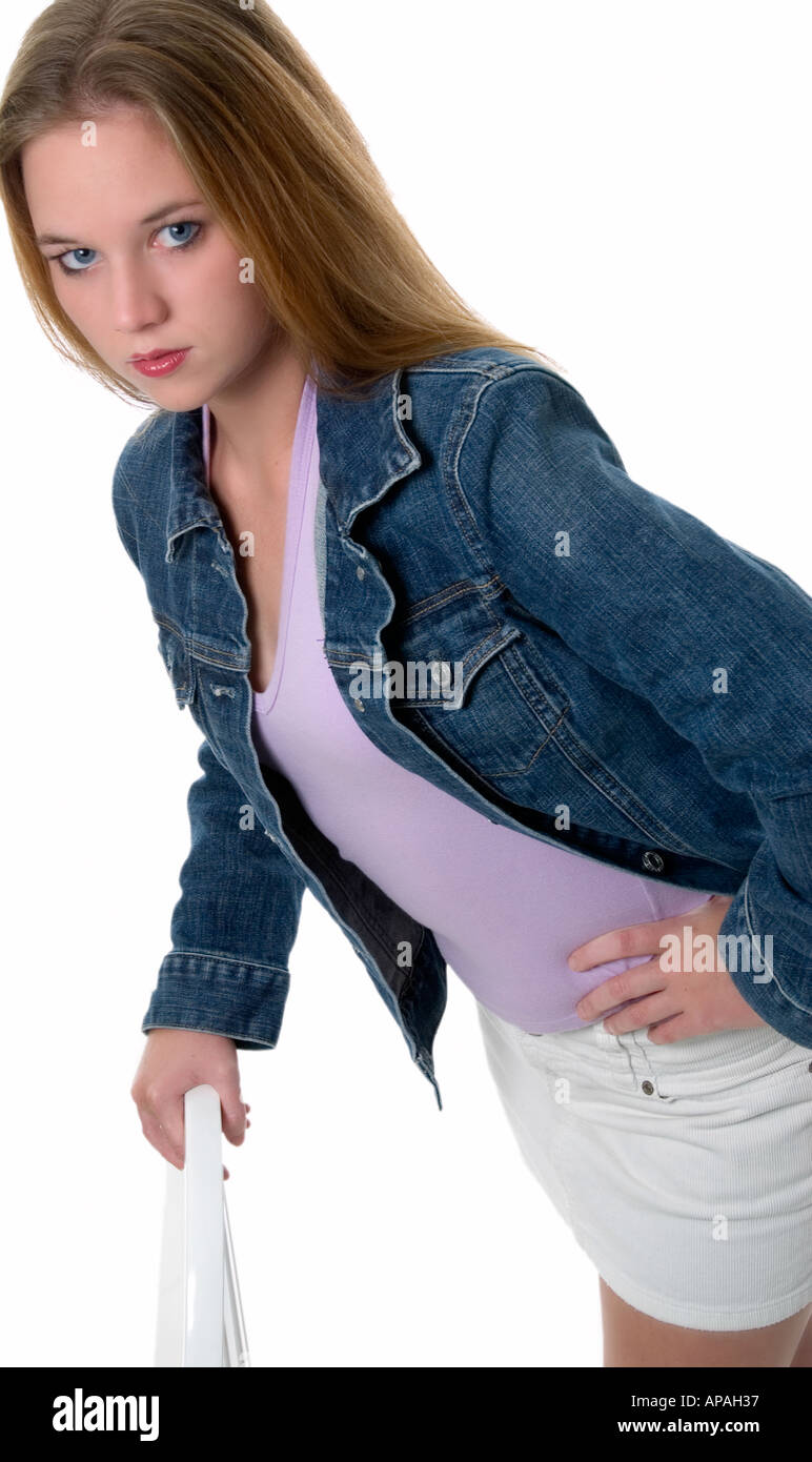 Teen caucasian girl wearing blue jean jacket and white shorts hires stock photography and