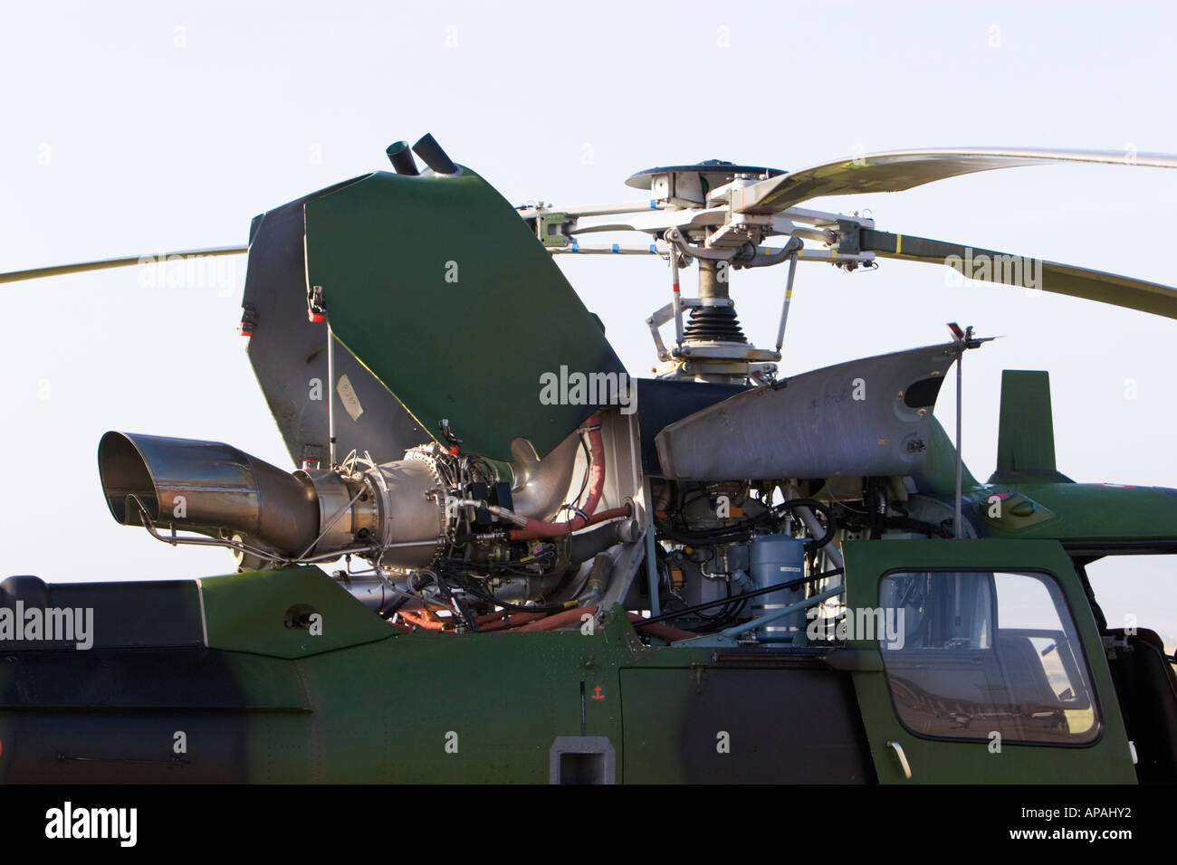 Open helicopter engine cowling and rotor blades Stock Photo Alamy
