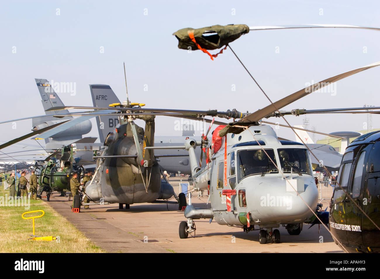 Flight line of military helicopters with tied down rotor blades at Leuchars Airshow 2006 Stock Photo