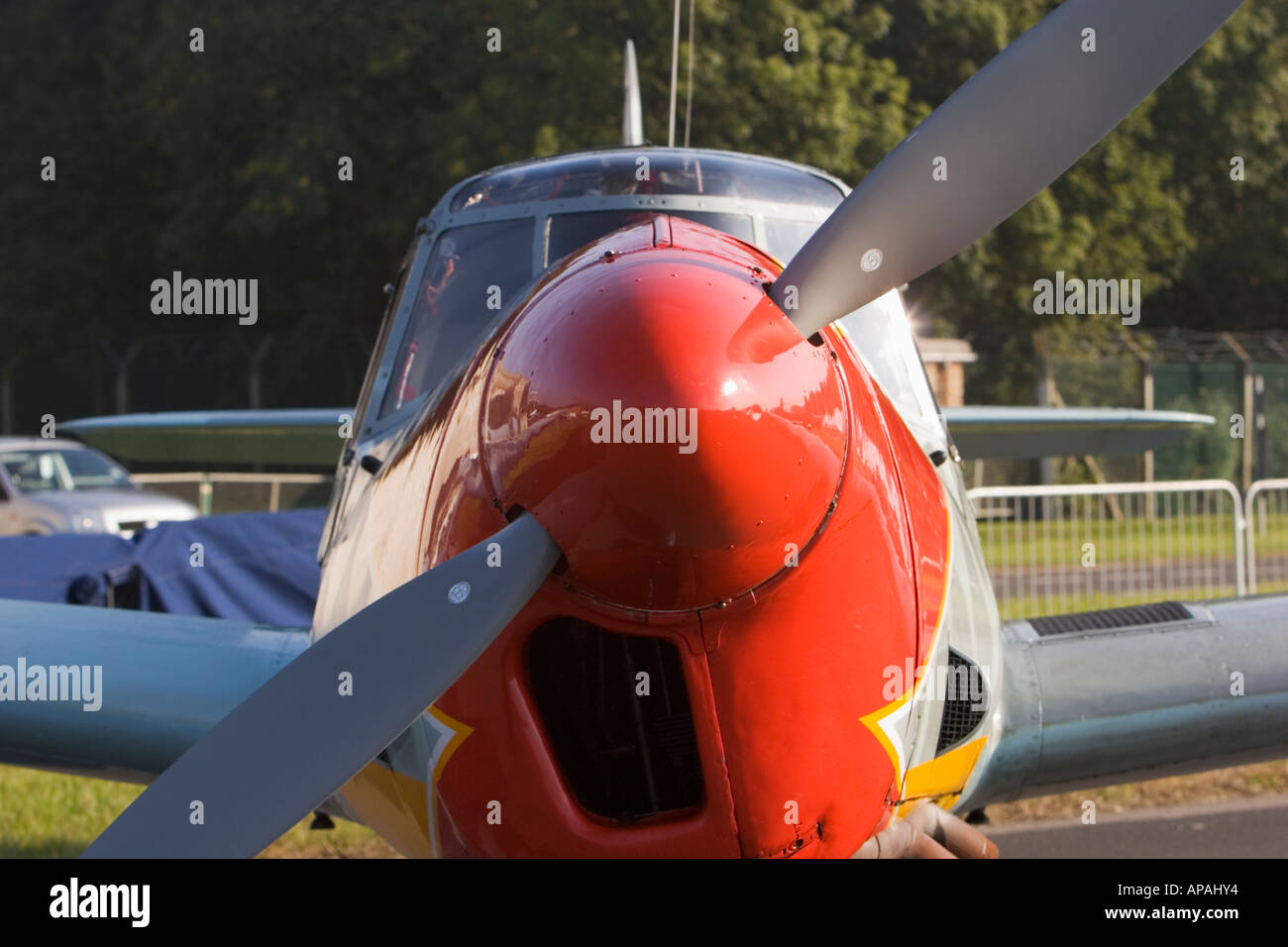 Bright red nose on single engine propeller aircraft Stock Photo