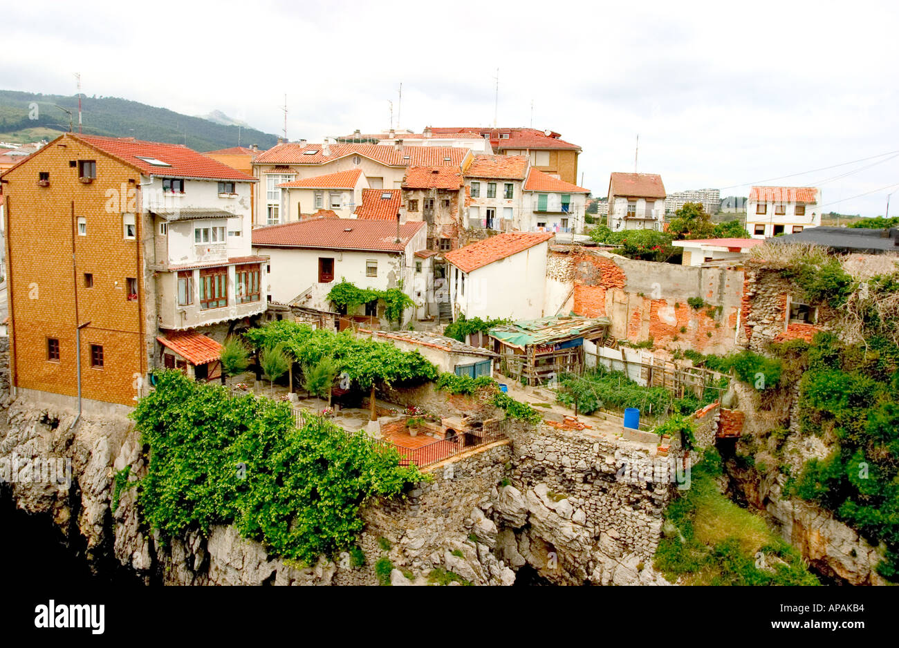 cudillero fishing village Asturias houses on top of rocks with ocean above Stock Photo