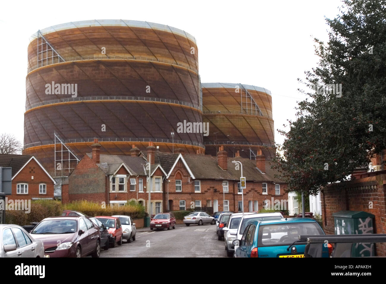 Gas storage tanks dwarf a Reading UK Street Stock Photo Alamy