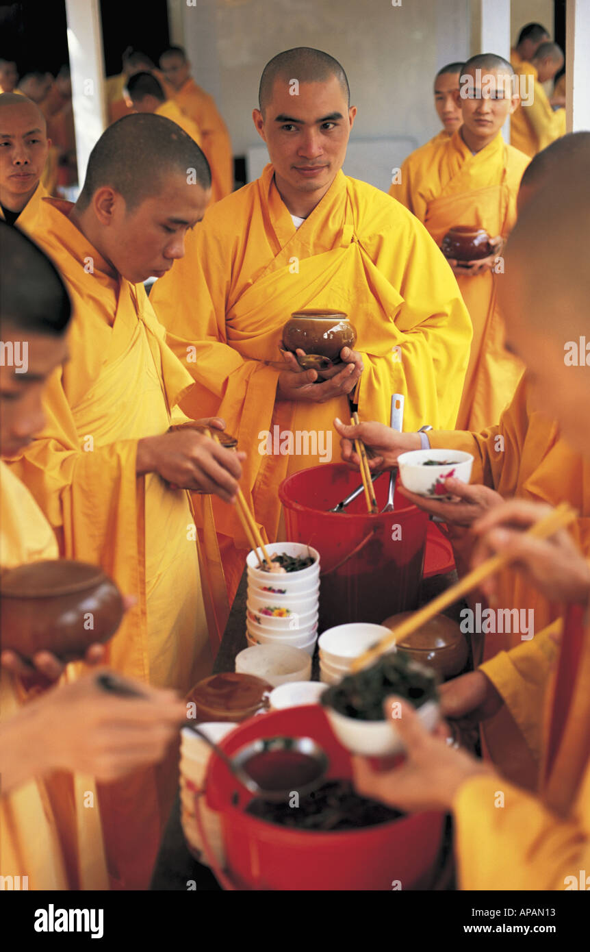 Monks serving food Hue Vietnam Stock Photo