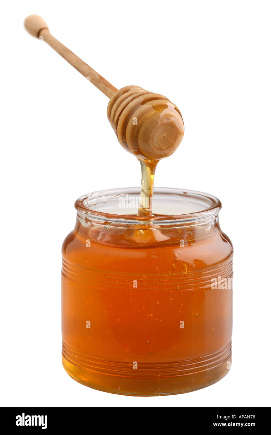 Honey pot with dripping honey Stock Photo
