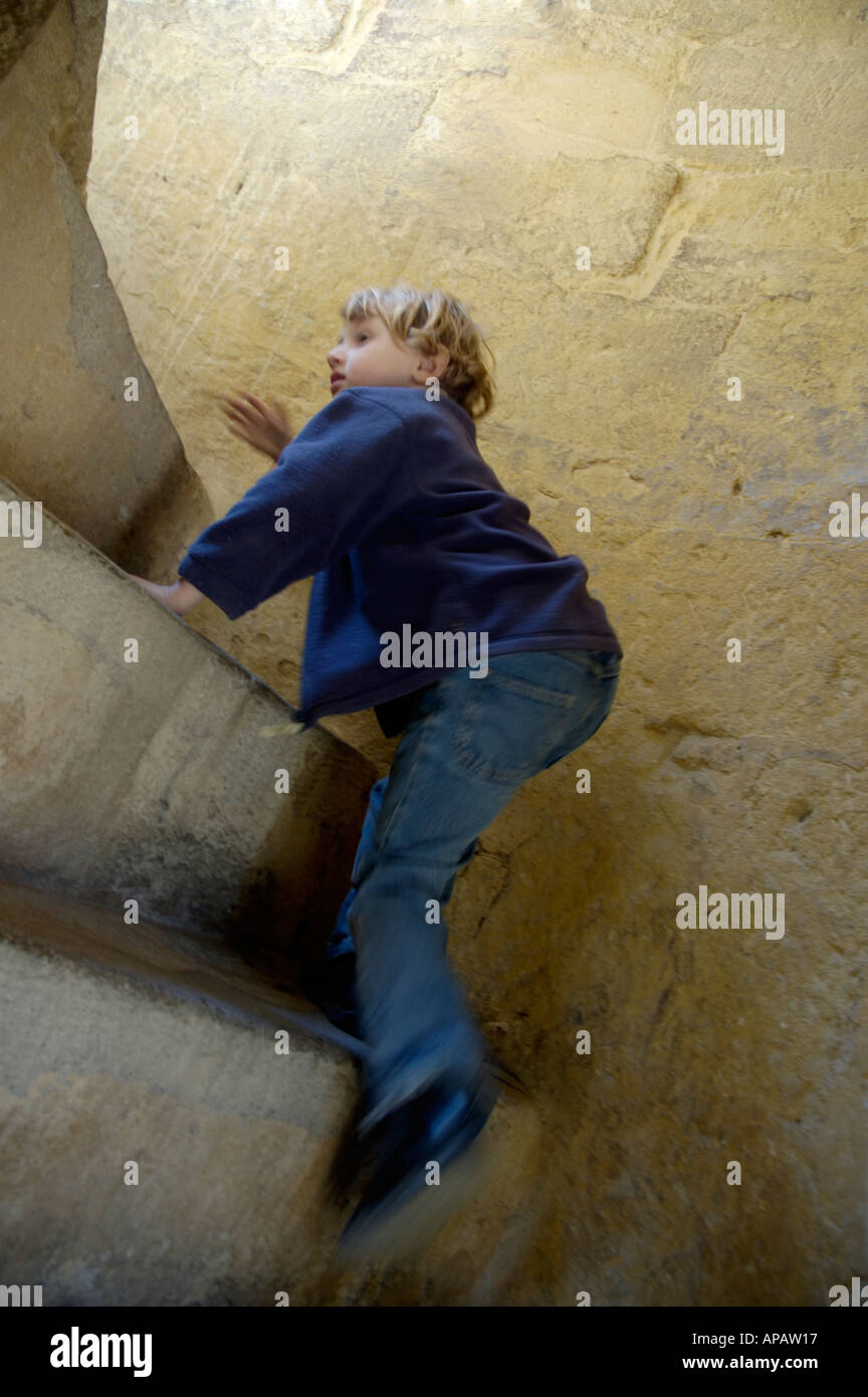 Spain andalusia cordoba alcazar of the christian kings little girl climbing inside the lion tower staircase Stock Photo