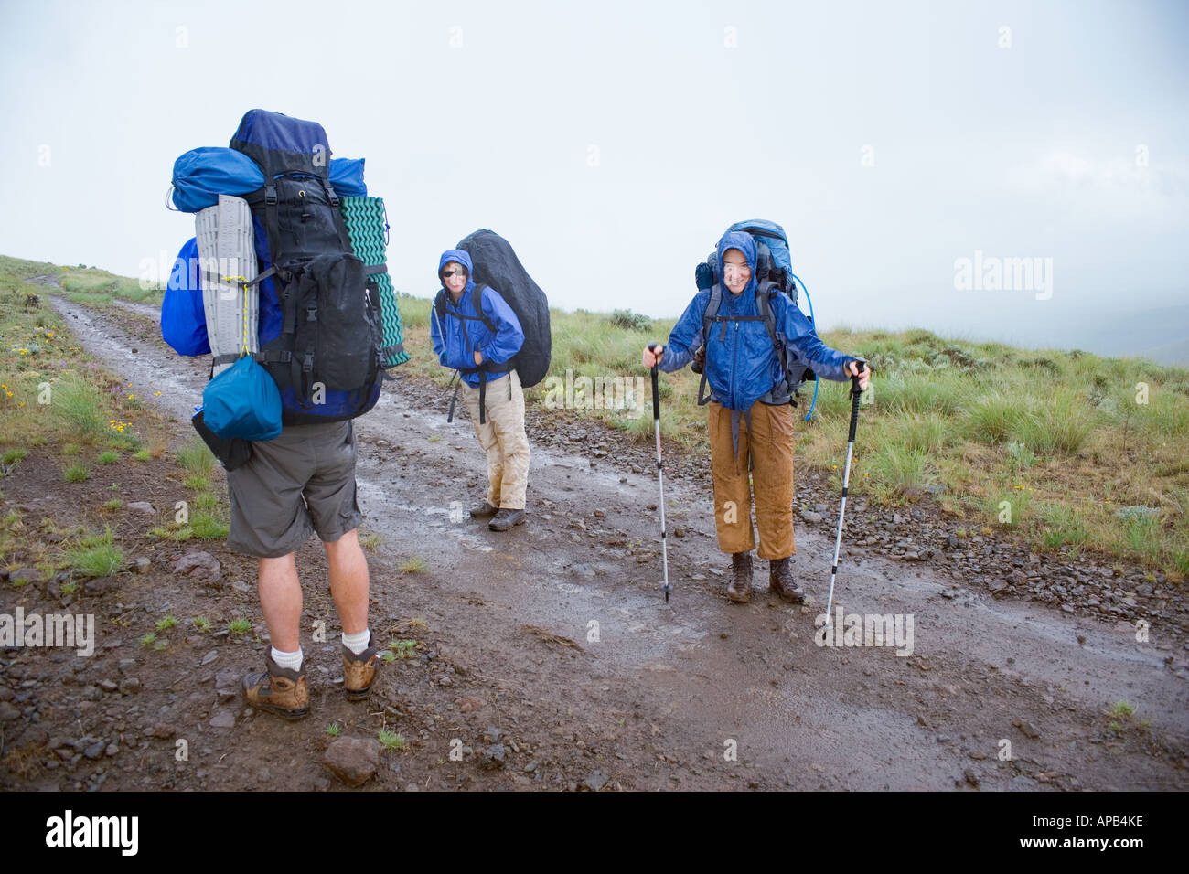 Backpackers in a rain storm Umptanum Ridge Washington USA Stock Photo