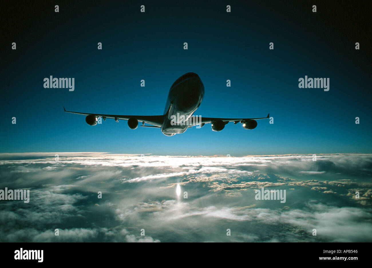 passenger aircraft in flight Airbus aircraft flying high above the clouds Stock Photo