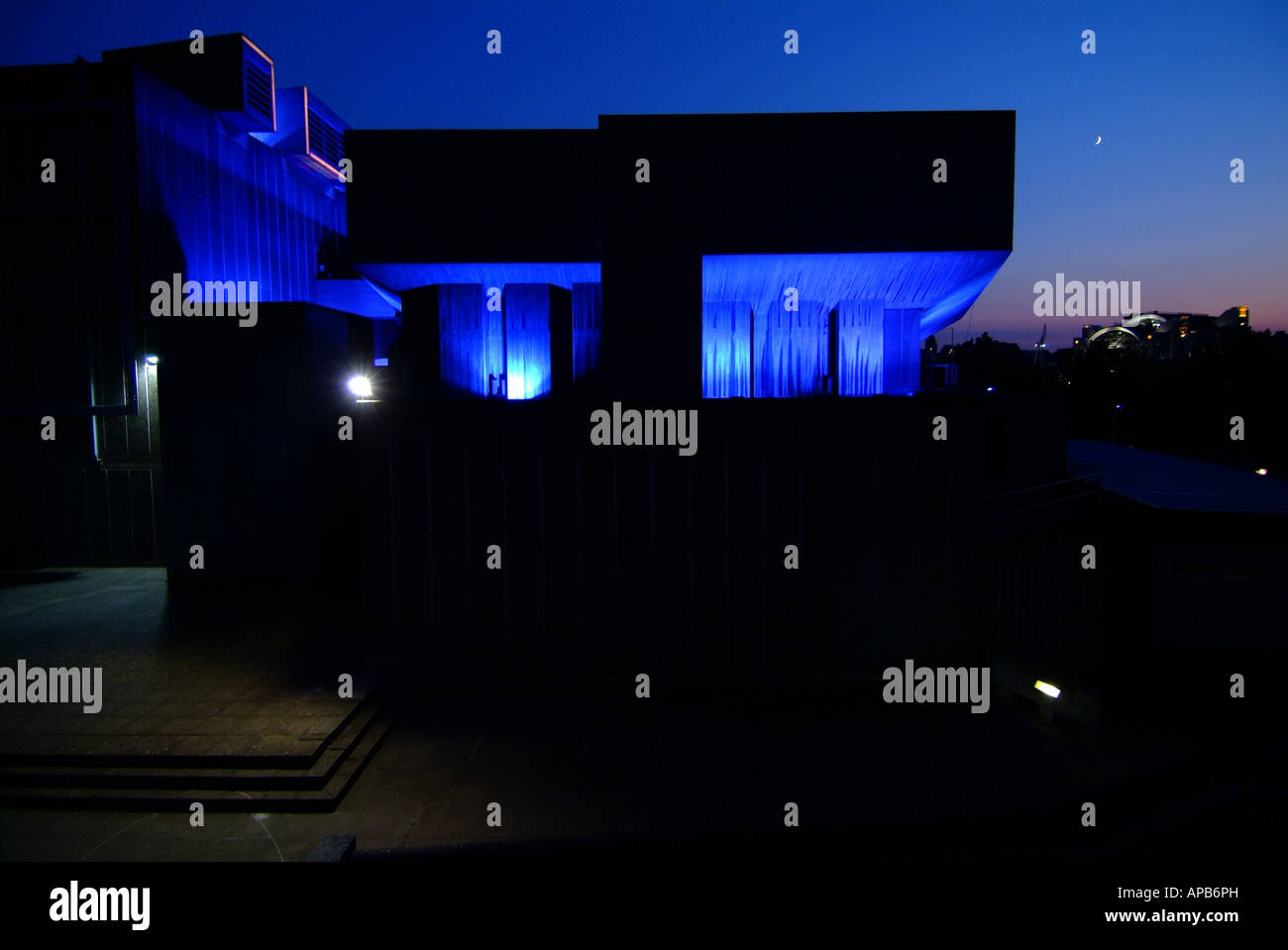 The back of the Royal festival hall on the south bank in london at night with blue lights shining onto it Stock Photo