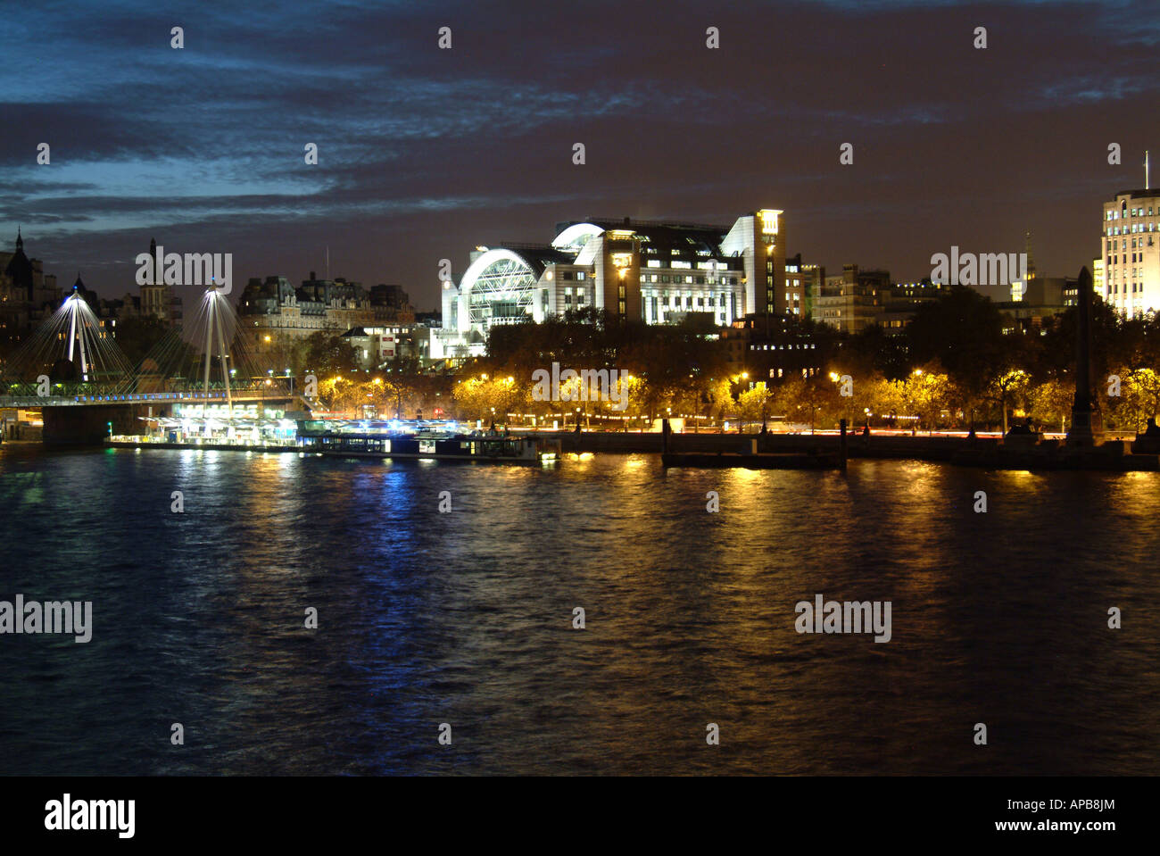 The River Thames at night looking over to Charing Cross train staion and hungerford bridge Stock Photo