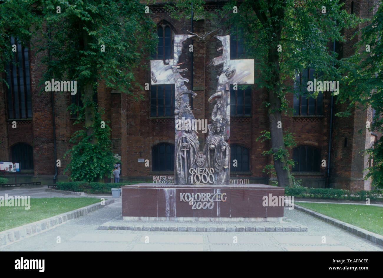 thousand year festival steel crucifix sculpture in front of th Maria cathedral Kolobrzeg Pommern Poland  Stock Photo