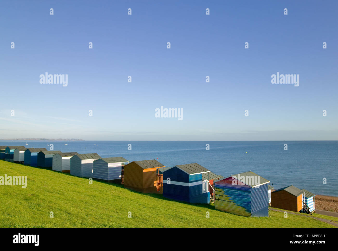 Beach huts overlooking the sea at Tankerton near Whitstable Kent England Stock Photo