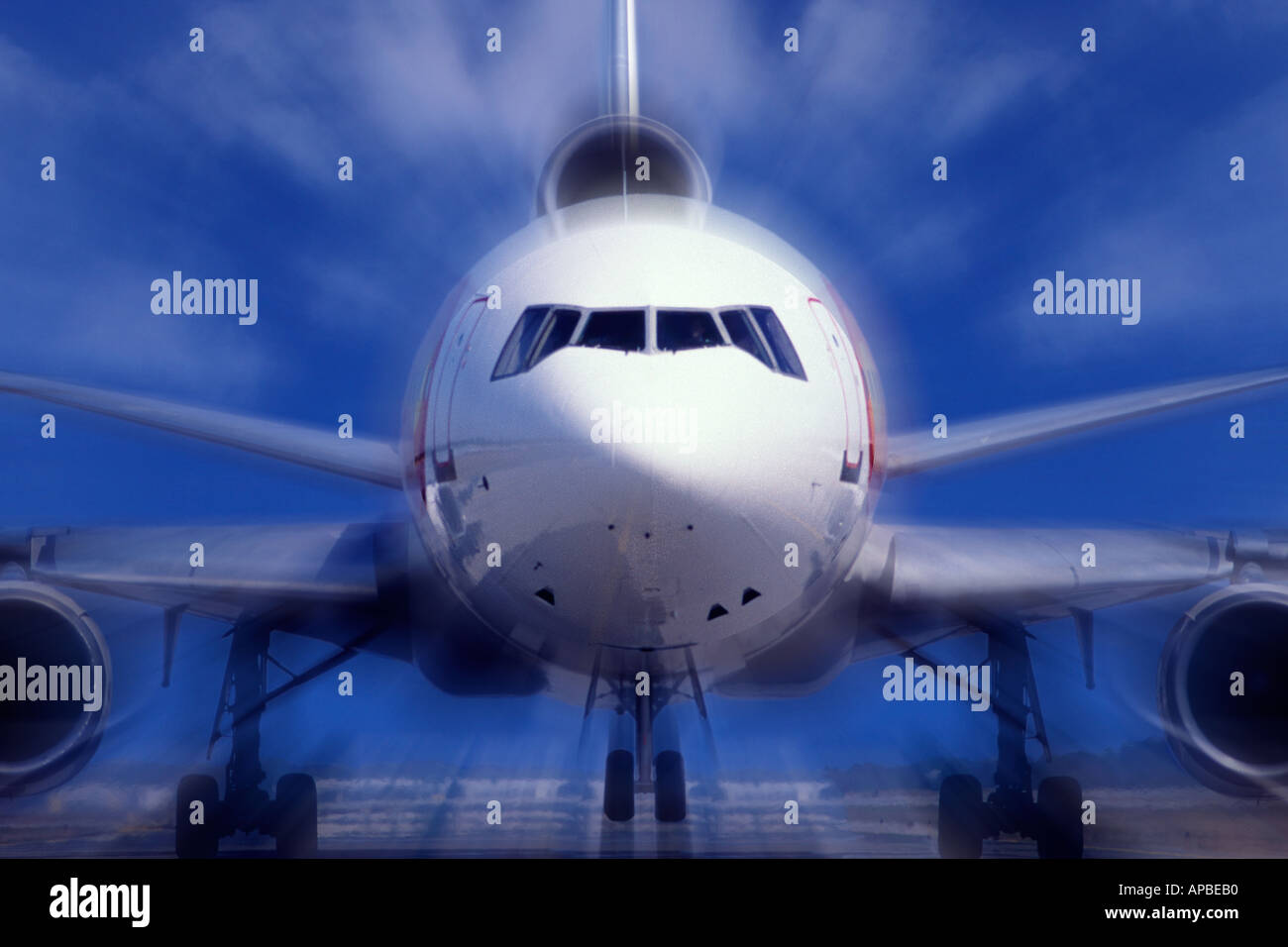 Commercial jet airliner on runway taking off with motion blur Stock