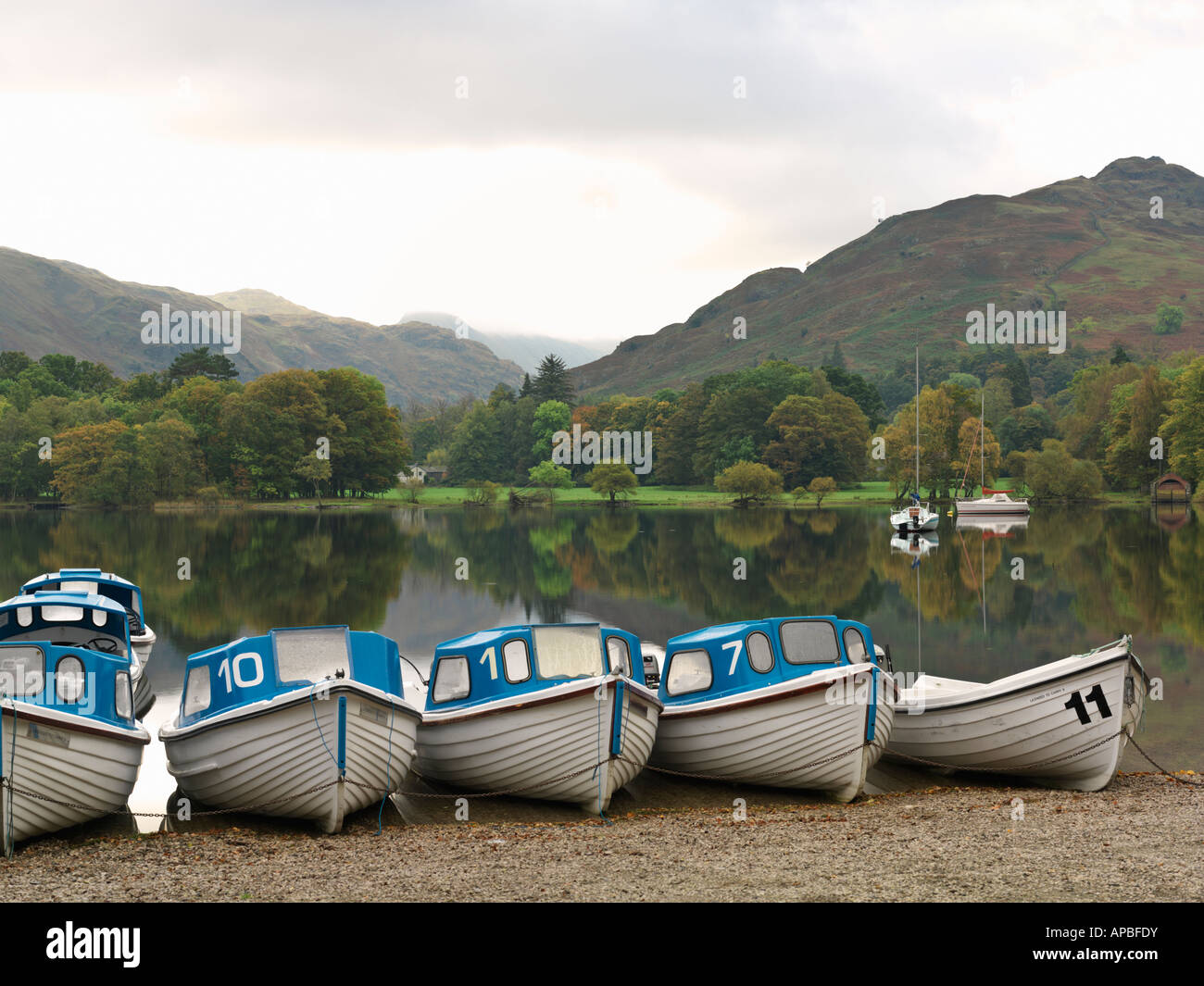 United Kingdom Cumbria Lake District National Park Ullswater Glenridding row of boats for rent at Ullswater Stock Photo