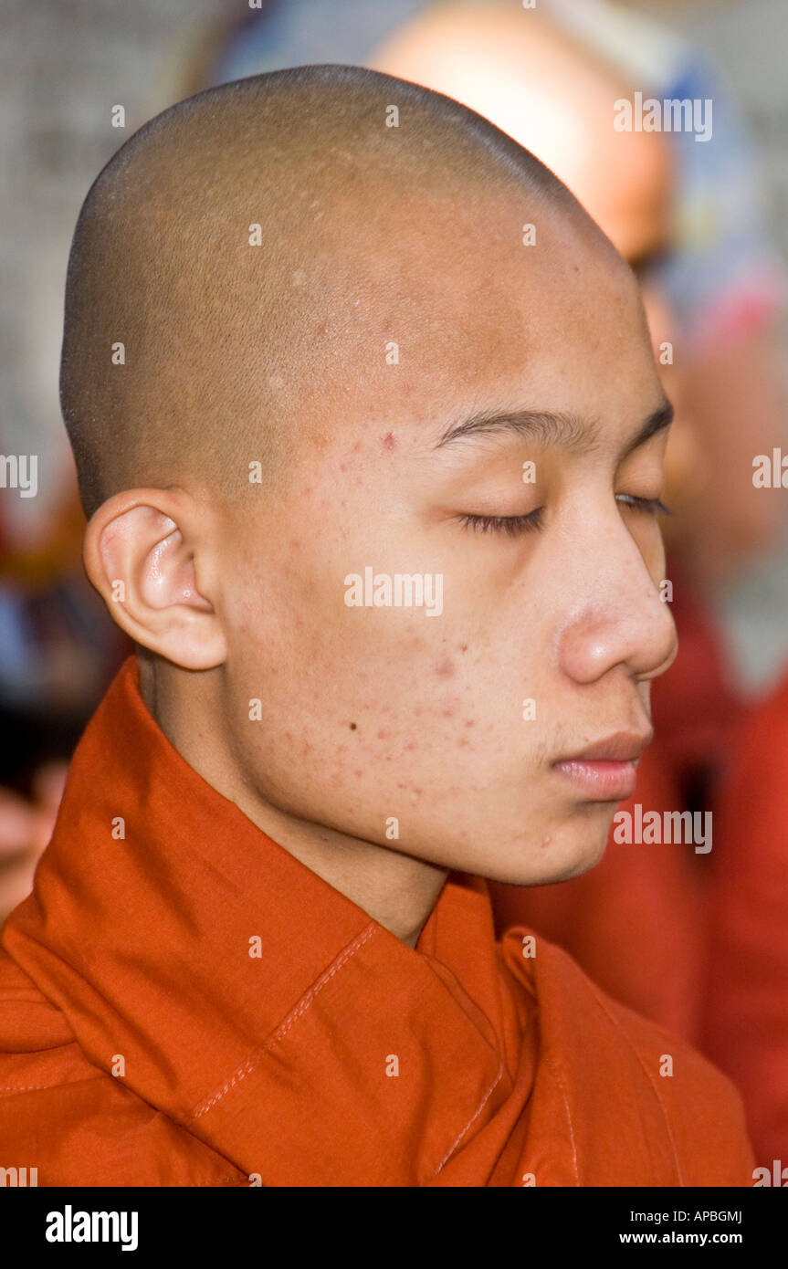 Novice monk in line for lunch at Maha Gandhayon Kyaung Monastery in Amarapura, Burma. Stock Photo