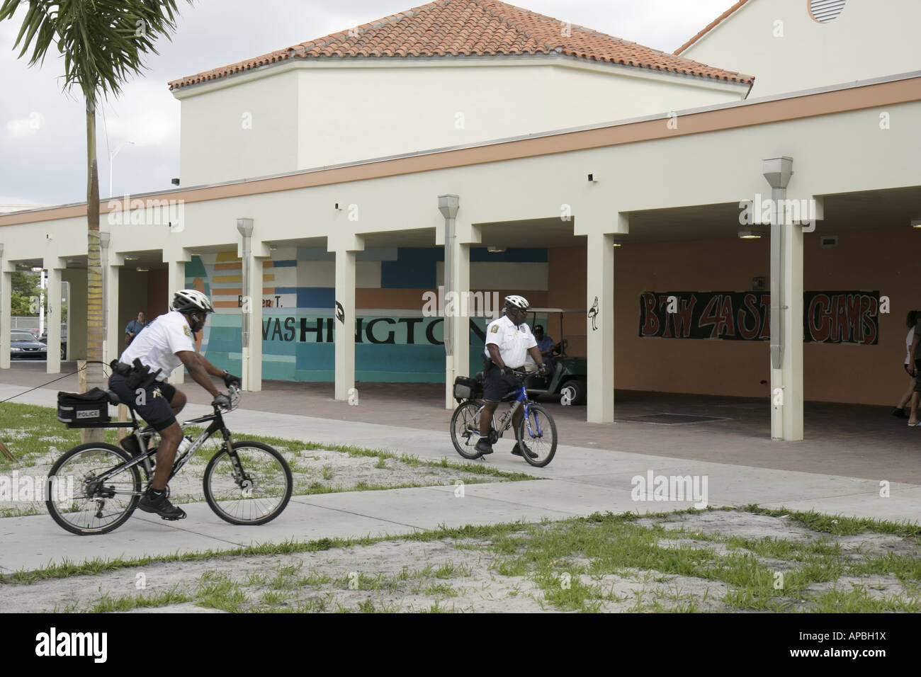 Miami Florida,Overtown,Booker T. Washington High School,campus,public education,campus,bicycle,bicycling,riding,biking,rider,bike patrol police,police Stock Photo