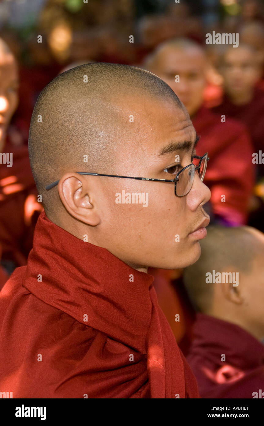 Novice monk in line for lunch at Maha Gandhayon Kyaung Monastery in Amarapura Burma Stock Photo