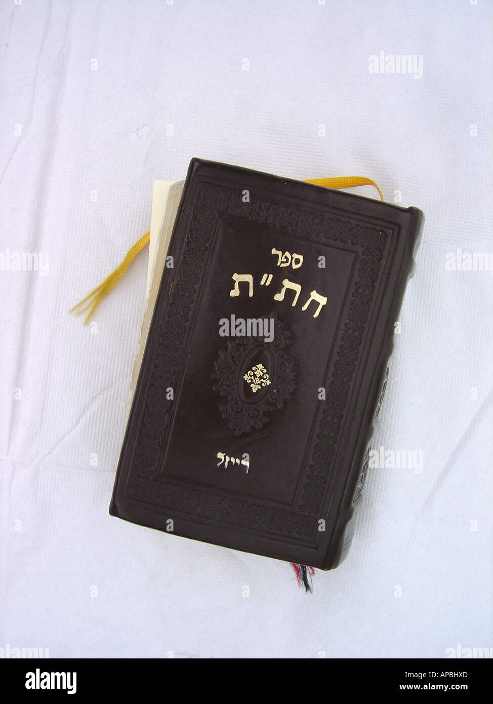 Still Life of a Bible With Hebrew Characters on its Cover Copy Space Stock Photo