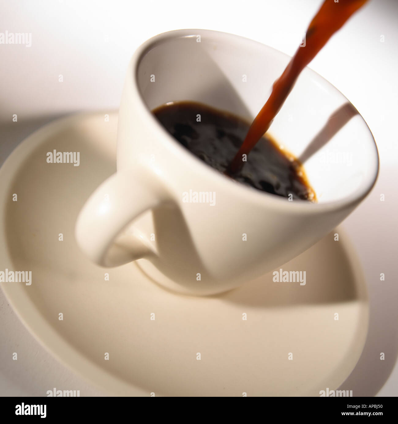 Coffee Cup with Poured Hot Coffee Stock Photo