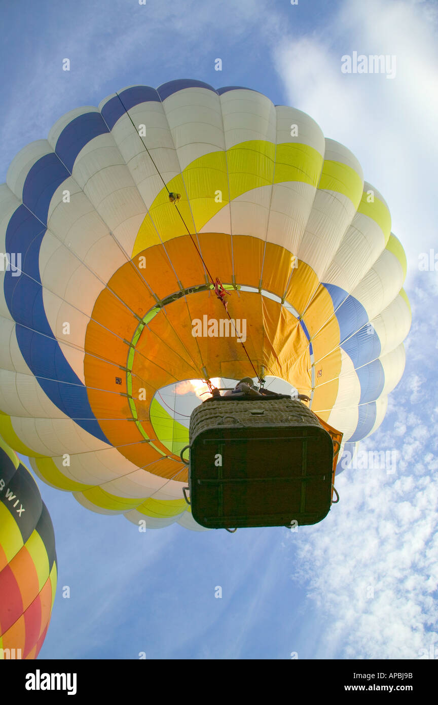 Hot Air Balloon Flying in Blue Sky Stock Photo - Alamy