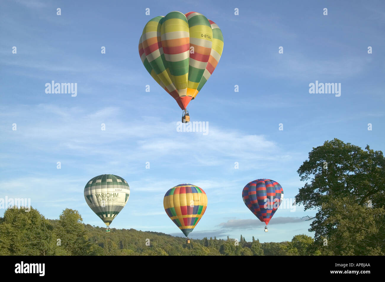 Hot Air Balloons Flying in Blue Sky Stock Photo - Alamy