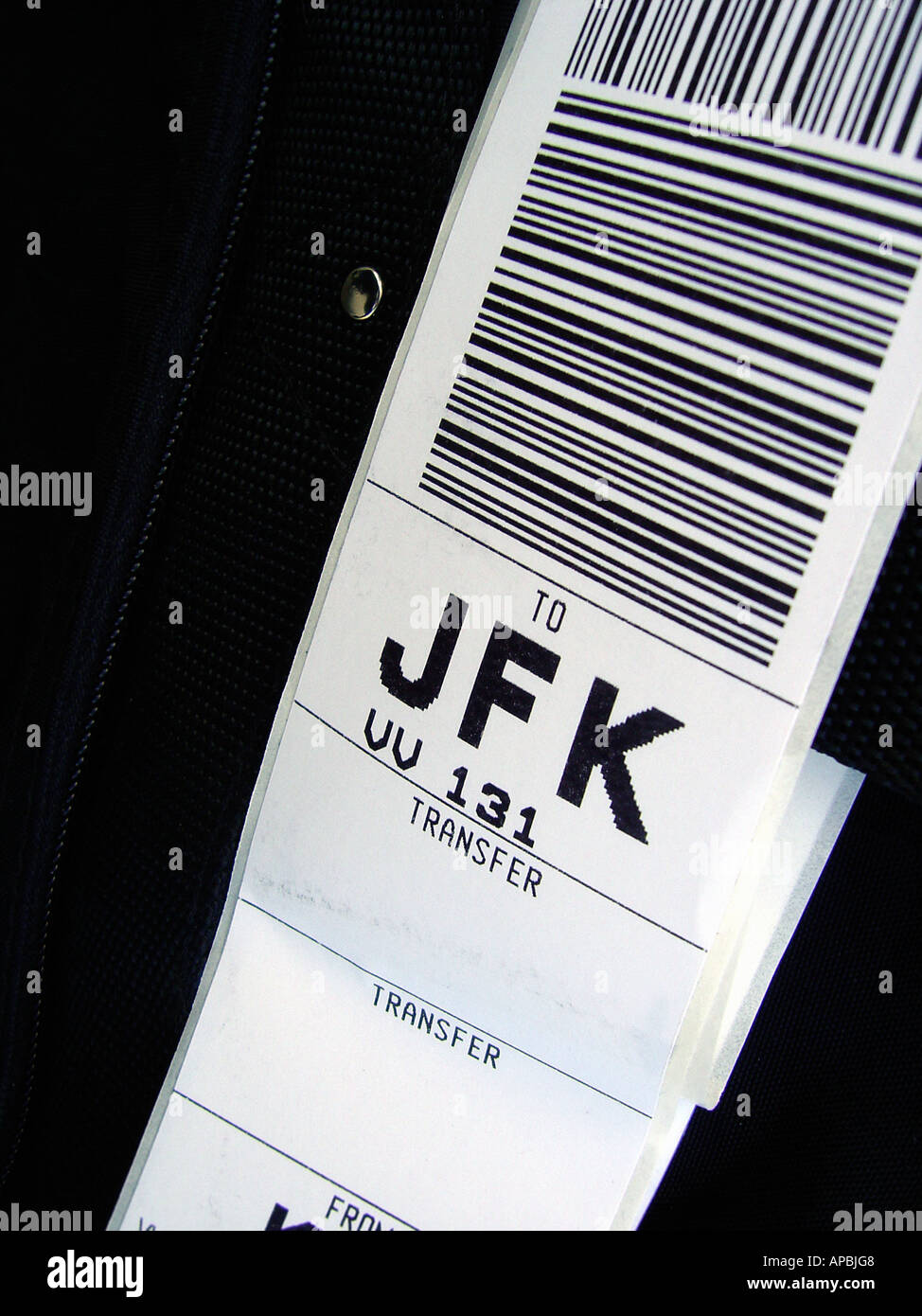 Closeup of a Luggage Tag enroute to John F Kennedy Airport in New York City Copy Space Stock Photo