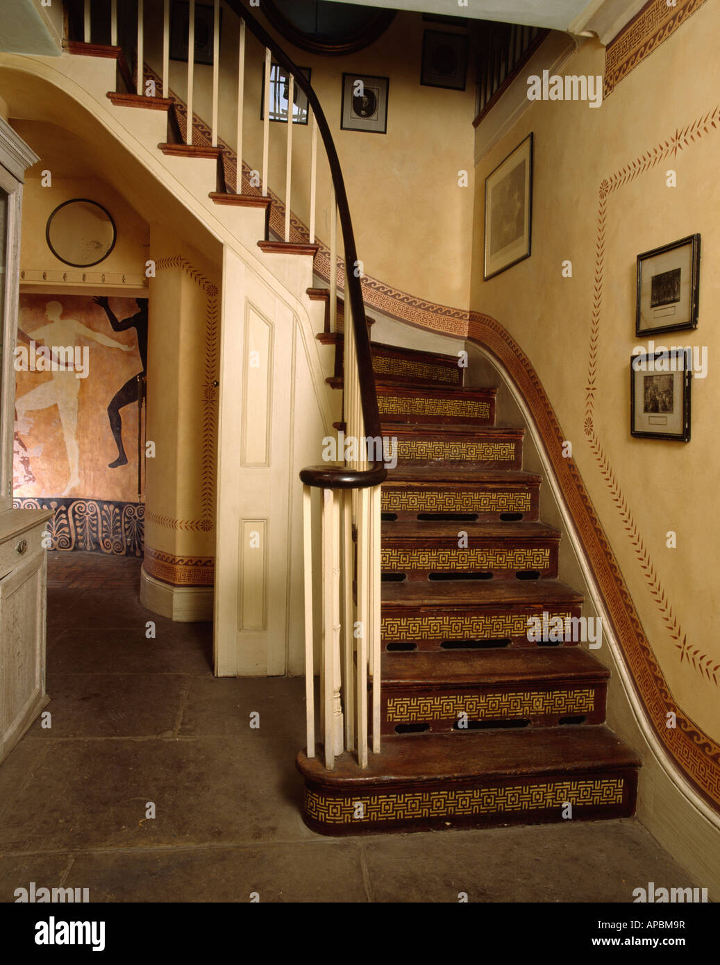 Wooden Staircase With Cream Bannisters In Neutral Hall With Stencilled Paint Effect Walls And Skirting Board Stock Photo Alamy