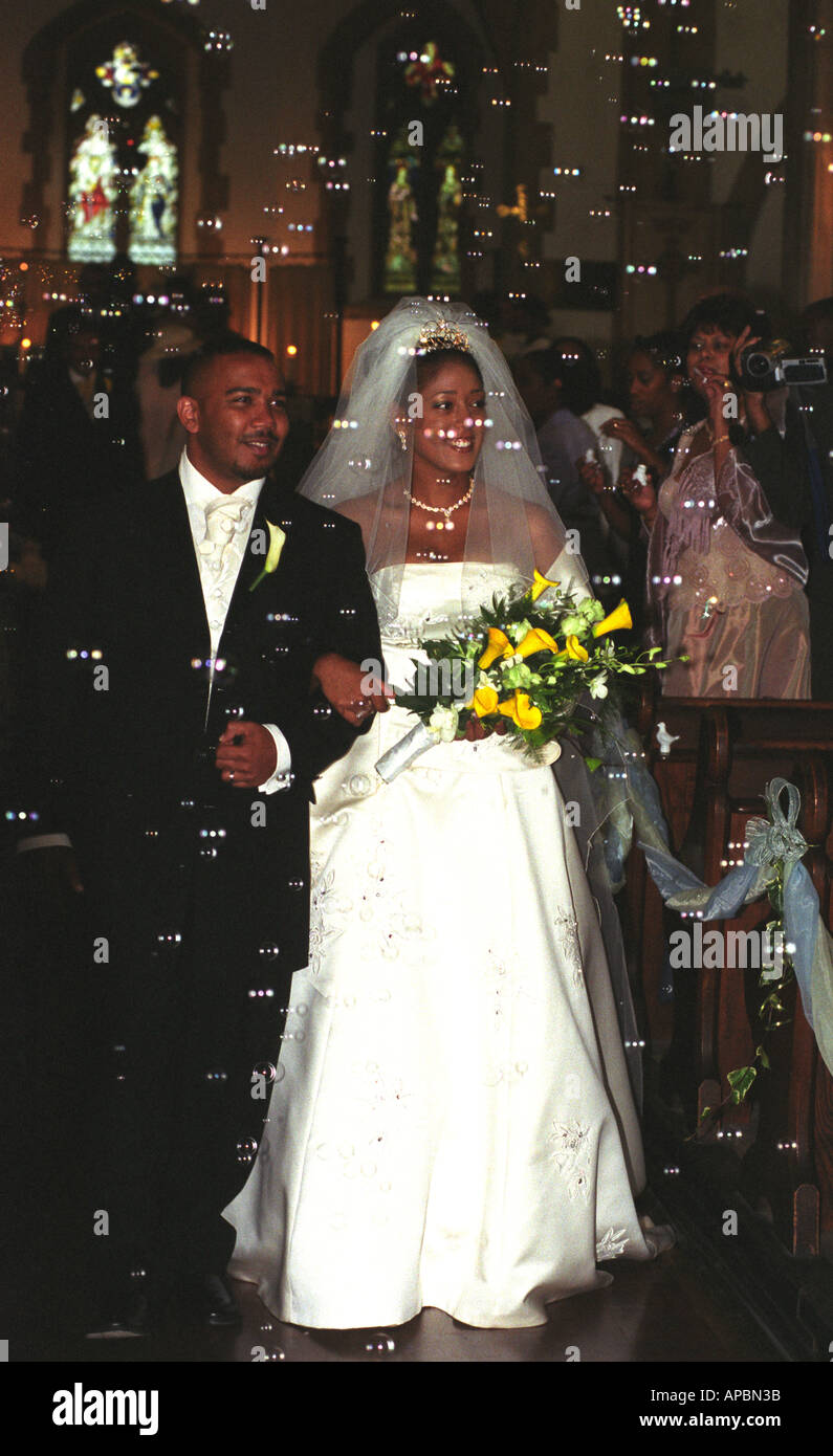 Young Black Couple Walking Down Aisle After Wedding Ceremony London