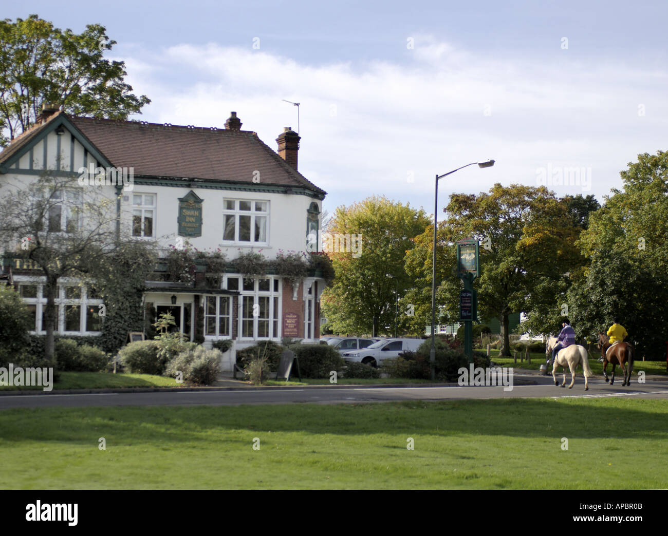 Country pub in Claygate Esher with two horses outside Stock Photo Alamy