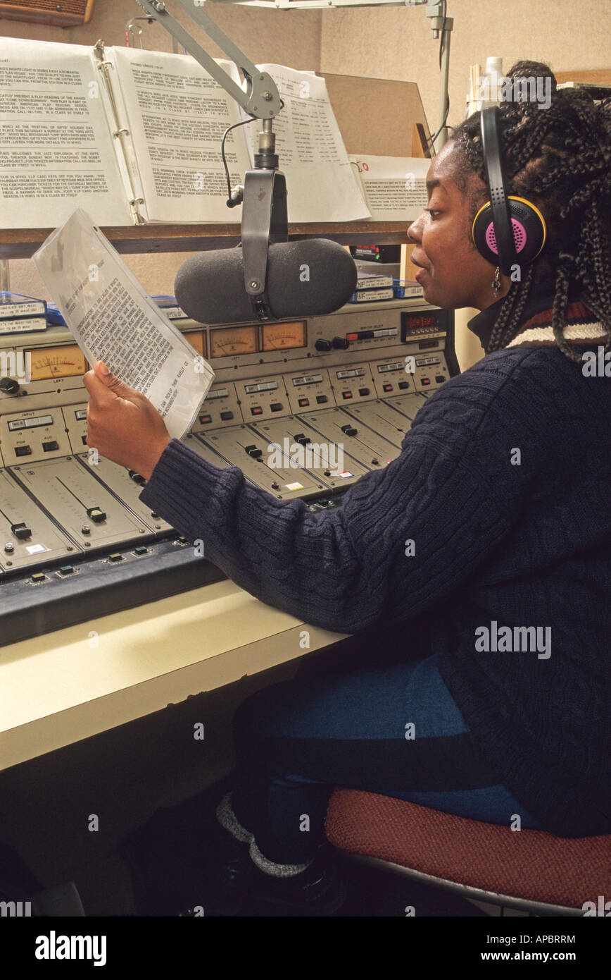 Radio D J broadcasting on the air Ohio USA career commuication media manuscript script announcing African American woman music Stock Photo