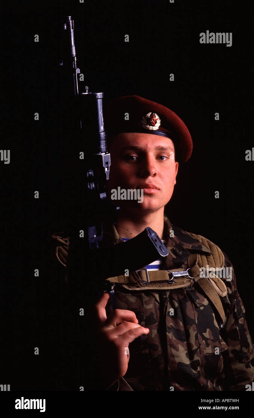 Portrait of a Red Army Soldier holding his Kalashnikov AK 74 assault rife. Stock Photo