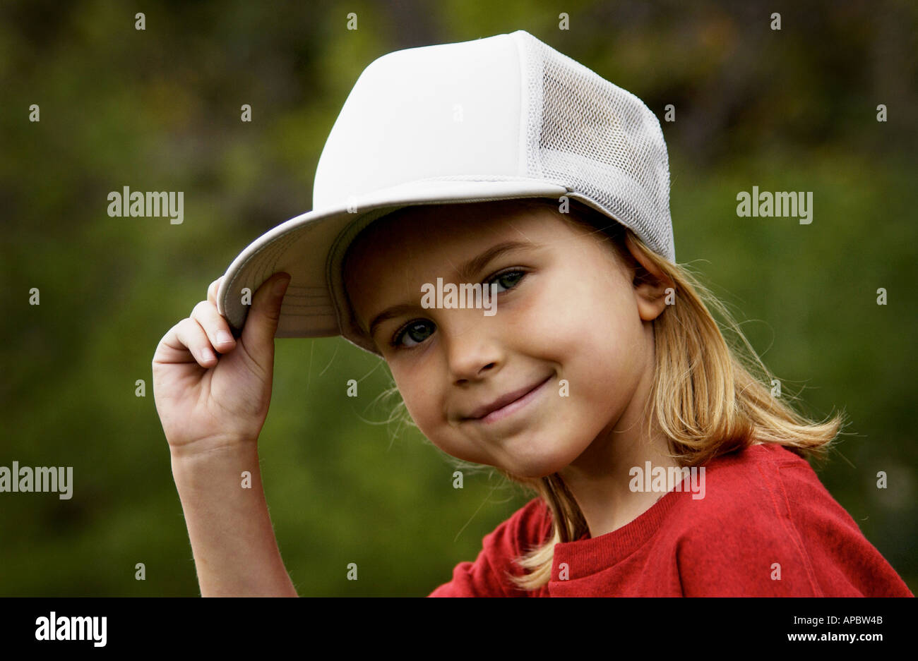 girls wearing baseball hats