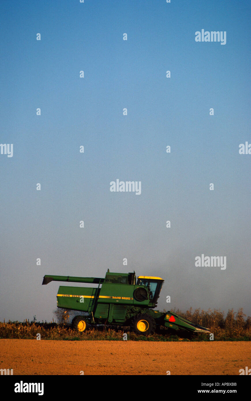 Combine harvesting corn on farm near Manheim Lancaster County Pennsylvania USA Stock Photo