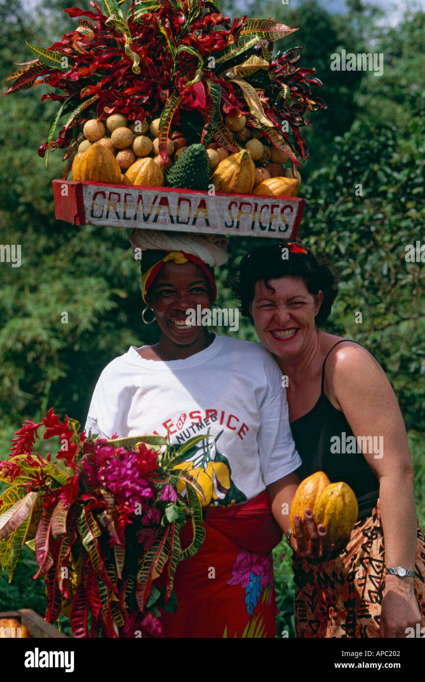Woman carrying a basket of fruit on her head Grenada Caribbean Stock