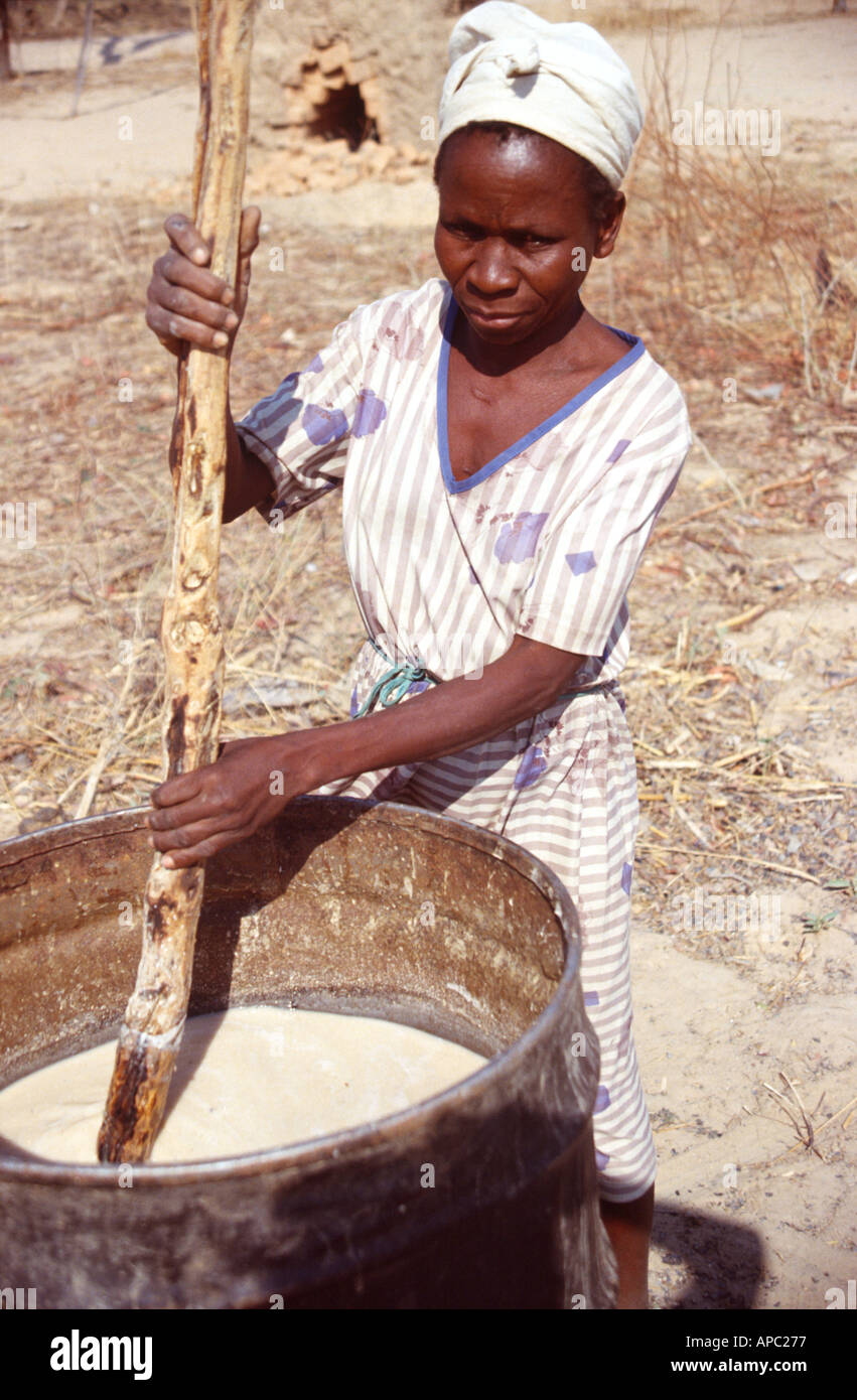 Woman brewing maize beer Northern Zimbabwe Africa Stock Photo
