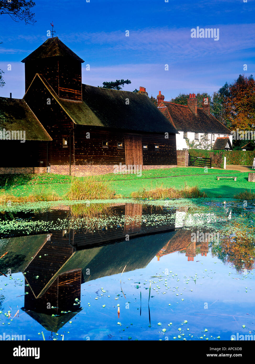 barn reflected in pond brighton sussex england uk Stock Photo - Alamy