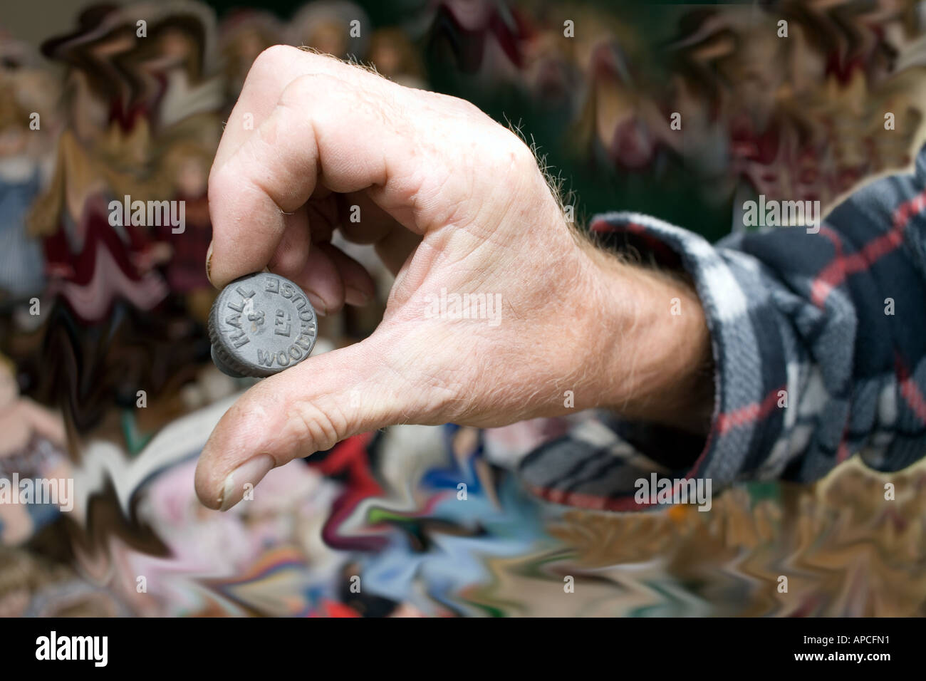 Hall Woodhouse bottle top Man male hand holding holds Hall Woodhouse