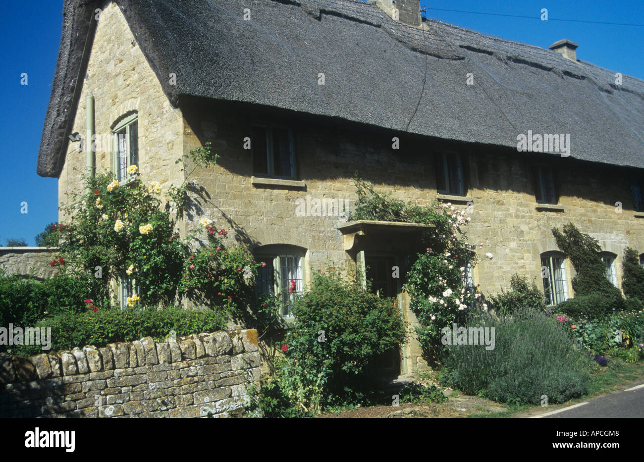 Typical Cotswold Stone Cottage at Taynton, near Burford, the Cotswolds, Oxfordshire, England, UK
