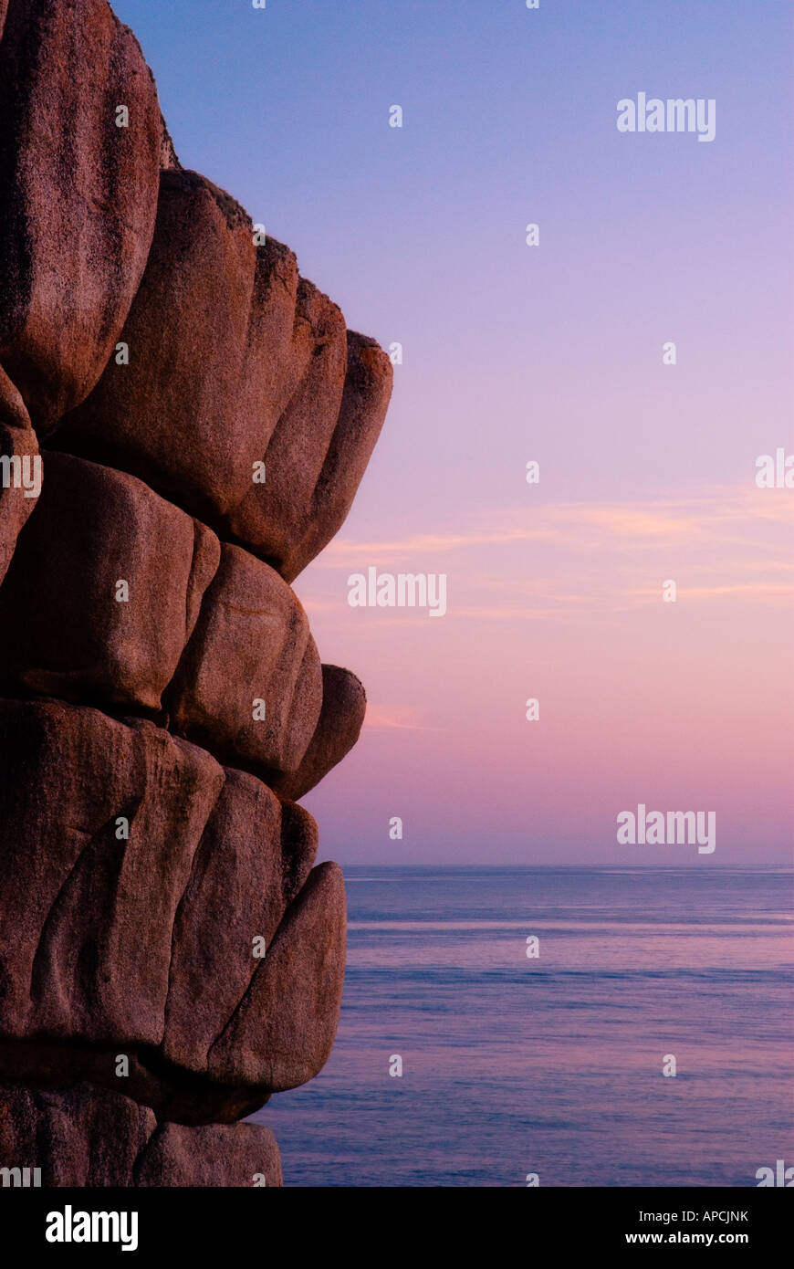 Rocks at dusk on Peninnis Head Scilly Isles England UK Stock Photo