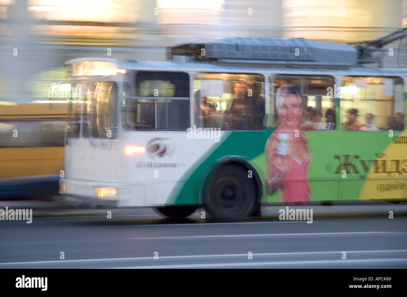 An electric bus speeds through Saint Petersburg Russia Stock Photo