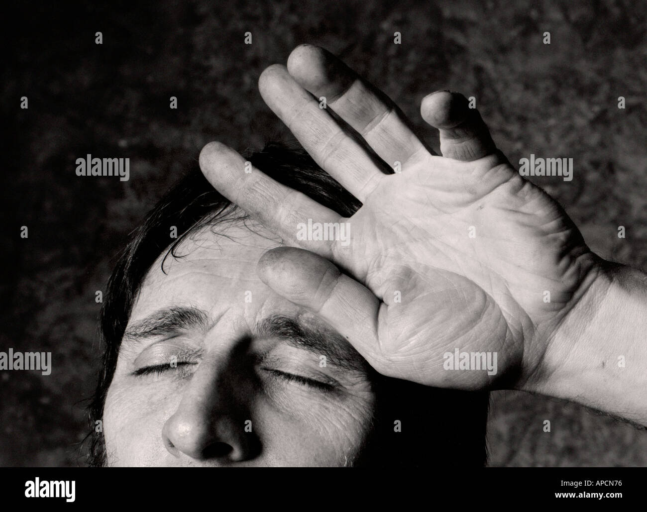 Man wiping brow Stock Photo Alamy